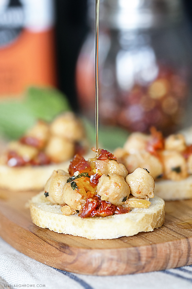 Savory Chickpea Crostini with Sun-Dried Tomatoes and Mint. This recipe makes a delicious snack or appetizer. Recipe at livelaughrowe.com