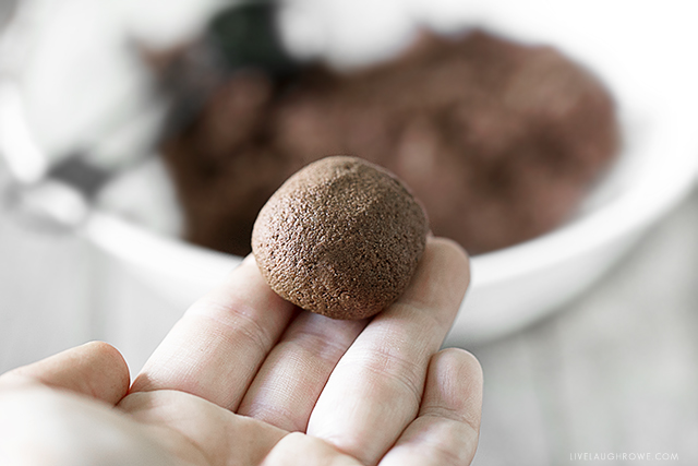 Rolling cinnamon applesauce into a ball