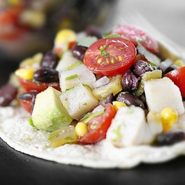 This Mexican specialty features avocado, corn and lime juice tossed together and piled high on crunchy corn tortillas. This tostada recipe is also WW friendly. Find this deliciousness at livelaughrowe.com