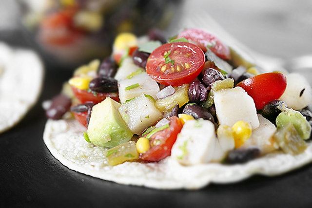 This Mexican specialty features avocado, corn and lime juice tossed together and piled high on crunchy corn tortillas. This tostada recipe is also WW friendly. Find this deliciousness at livelaughrowe.com