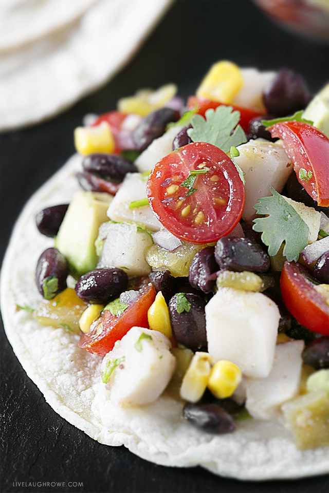 This Mexican specialty features avocado, corn and lime juice tossed together and piled high on crunchy corn tortillas. This tostada recipe is also WW friendly. Find this deliciousness at livelaughrowe.com