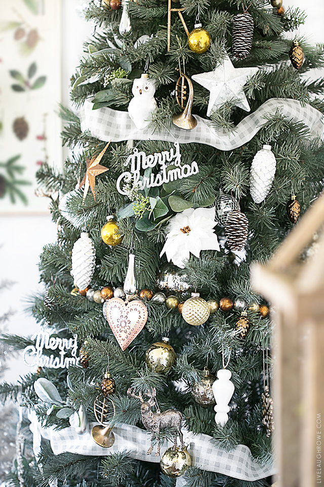 Beautiful Silver and Gold Christmas Tree . So many great ideas and the red accents in the wrapping paper and decor is lovely. livelaughrowe.com