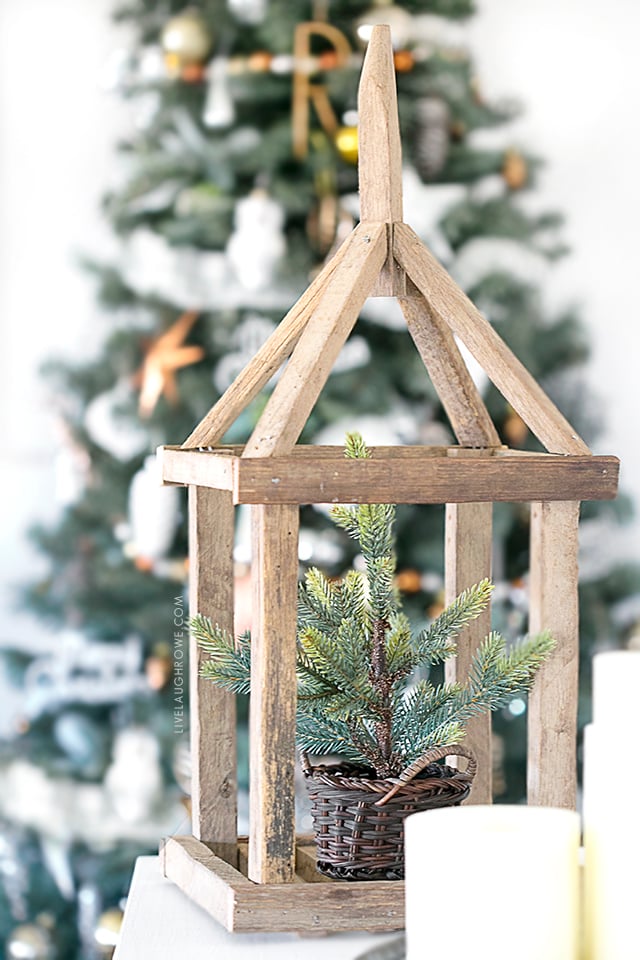 AWESOME wooden framed lantern! So many beautiful Christmas decor ideas. Lovely Silver and Gold Christmas tree too. livelaughrowe.com