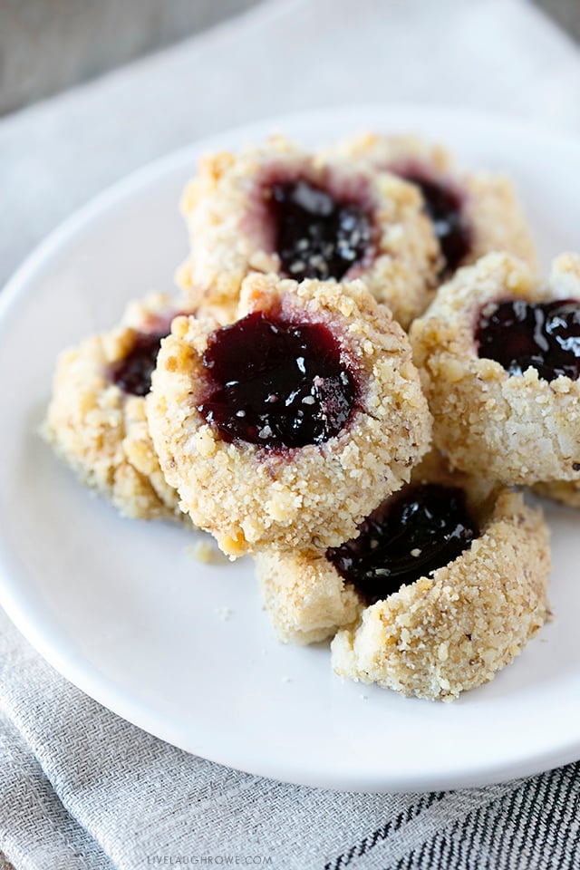 These thumbprint cookies are delicious, buttery little cookies filled with jam and rolled in nuts. This Thumbprint Cookie Recipe is not only a sweet treat, it's also incredibly easy to make. Recipe at livelaughrowe.com