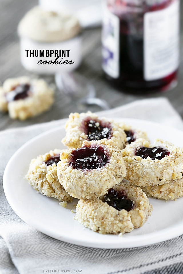 These thumbprint cookies are delicious, buttery little cookies filled with jam and rolled in nuts. This Thumbprint Cookie Recipe is not only a sweet treat, it's also incredibly easy to make. Recipe at livelaughrowe.com