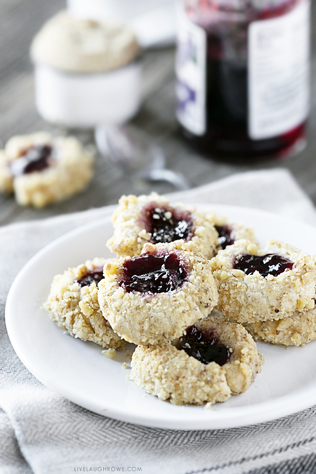 These thumbprint cookies are delicious, buttery little cookies filled with jam and rolled in nuts. This Thumbprint Cookie Recipe is not only a sweet treat, it's also incredibly easy to make. Recipe at livelaughrowe.com