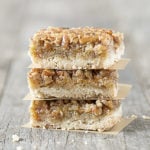 These AMAZING Pecan Pie Bars are not only a delicious dessert bar, but they're also a great crowd pleaser. Flaky shortbread crust with an incredible pecan pie filling will make these a new favorite. Recipe at livelaughrowe.com #pecanpie #dessertbar