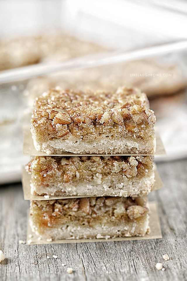 These AMAZING Pecan Pie Bars are not only a delicious dessert bar, but they're also a great crowd pleaser. Flaky shortbread crust with an incredible pecan pie filling will make these a new favorite. Recipe at livelaughrowe.com #pecanpie #dessertbar