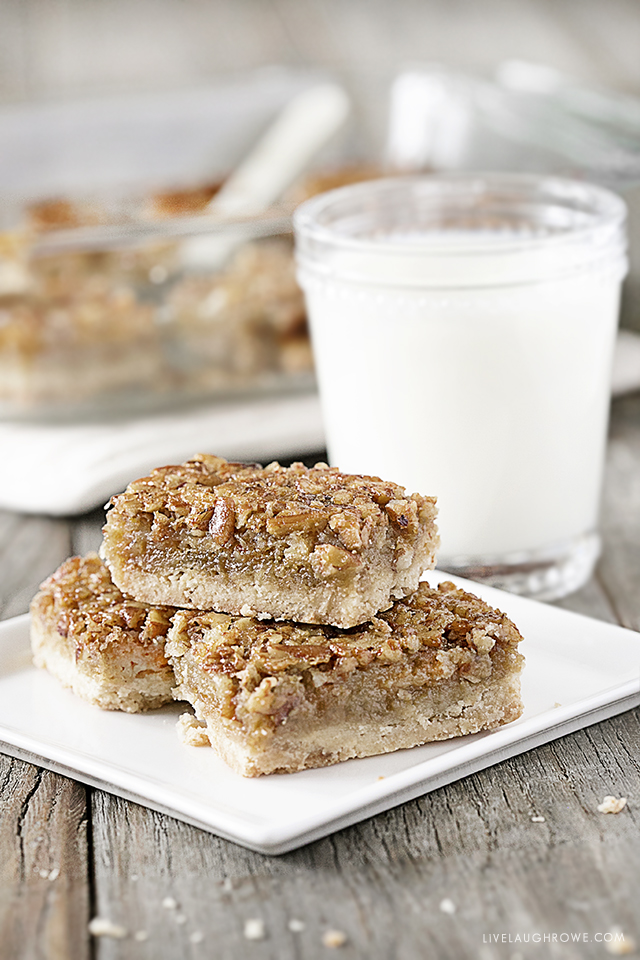 These AMAZING Pecan Pie Bars are not only a delicious dessert bar, but they're also a great crowd pleaser. Flaky shortbread crust with an incredible pecan pie filling will make these a new favorite. Recipe at livelaughrowe.com #pecanpie #dessertbar