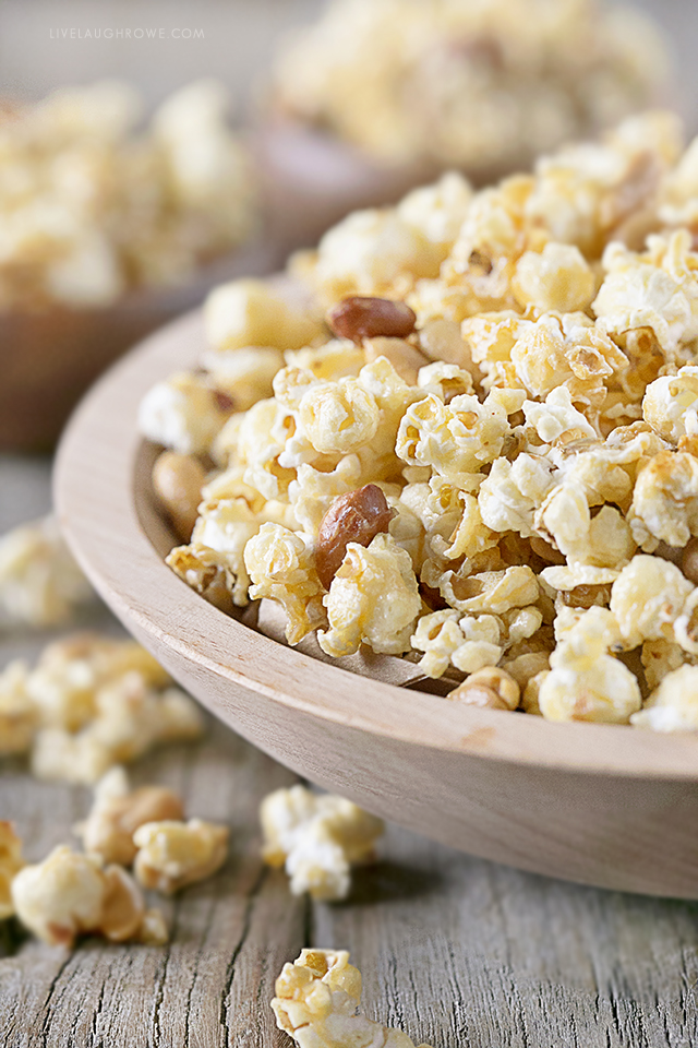 This homemade popcorn recipe is the bomb-diggity! If you enjoy a sweet and salty popcorn treat, then this might just be a new favorite. Did I mention it's super easy to make too?!? Recipe at livelaughrowe.com #sweetandsalty #popcornrecipe #snack #peanuts