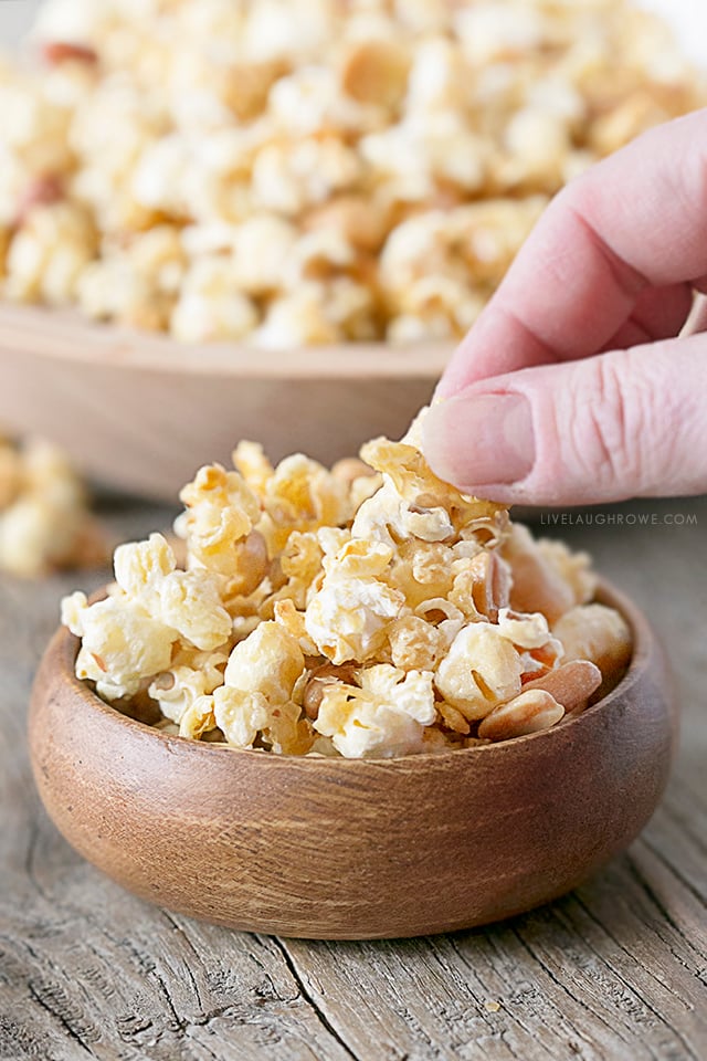 This homemade popcorn recipe is the bomb-diggity! If you enjoy a sweet and salty popcorn treat, then this might just be a new favorite. Did I mention it's super easy to make too?!? Recipe at livelaughrowe.com #sweetandsalty #popcornrecipe #snack #peanuts