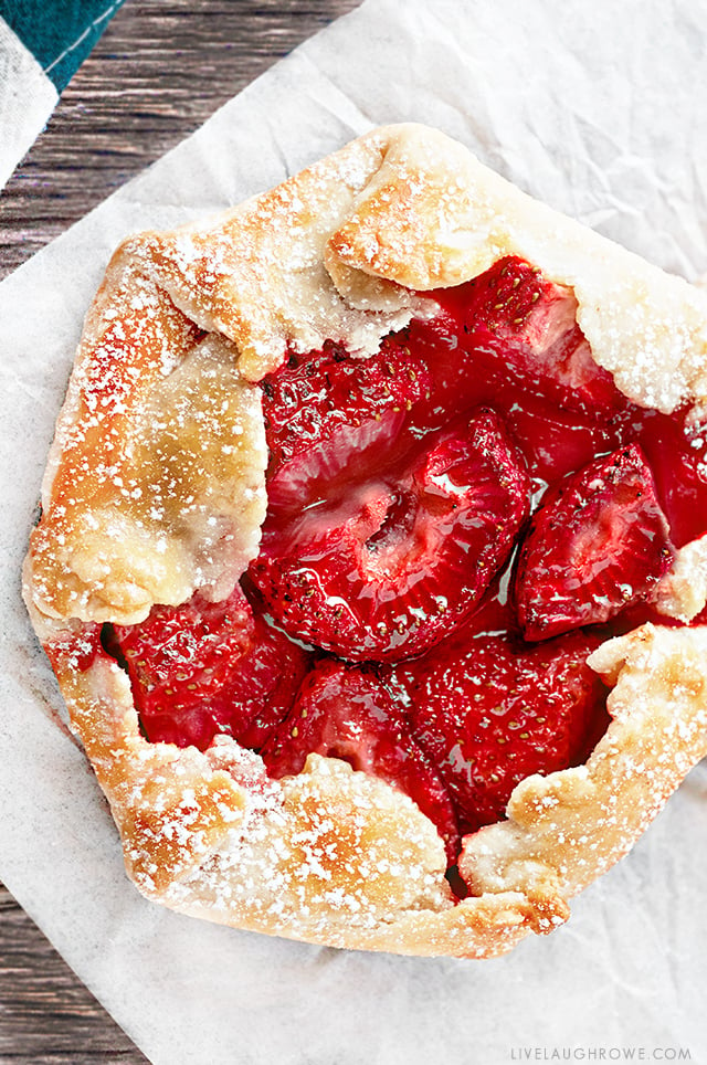 The free form flaky pie crust wrapped around the fruit makes these Mini Strawberry Galettes as easy as pie! A simple rustic, summer dessert . Recipe at livelaughrowe.com