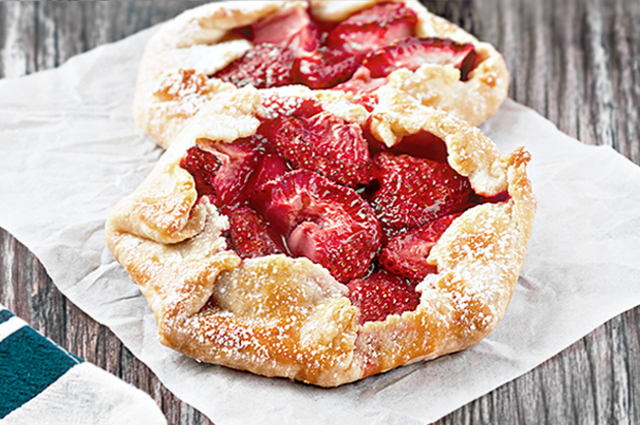The free form flaky pie crust wrapped around the fruit makes these Mini Strawberry Galettes as easy as pie! A simple rustic, summer dessert . Recipe at livelaughrowe.com