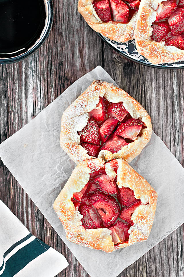 The free form flaky pie crust wrapped around the fruit makes these Mini Strawberry Galettes as easy as pie! A simple rustic, summer dessert . Recipe at livelaughrowe.com