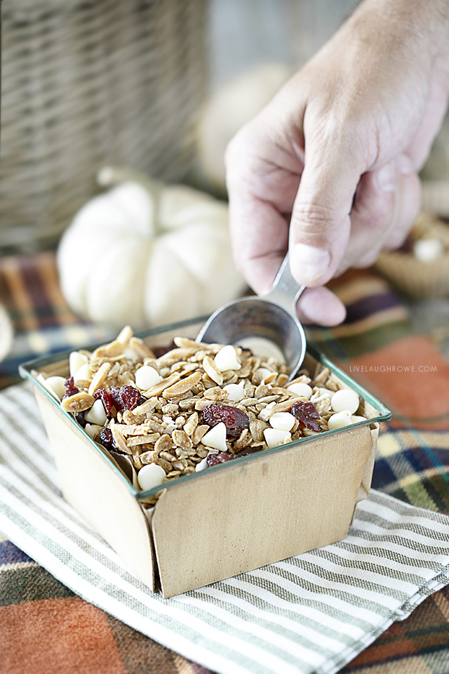 Scooping granola from container