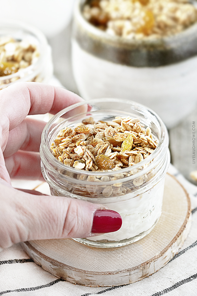 Hand Reaching for jar of granola and yogurt