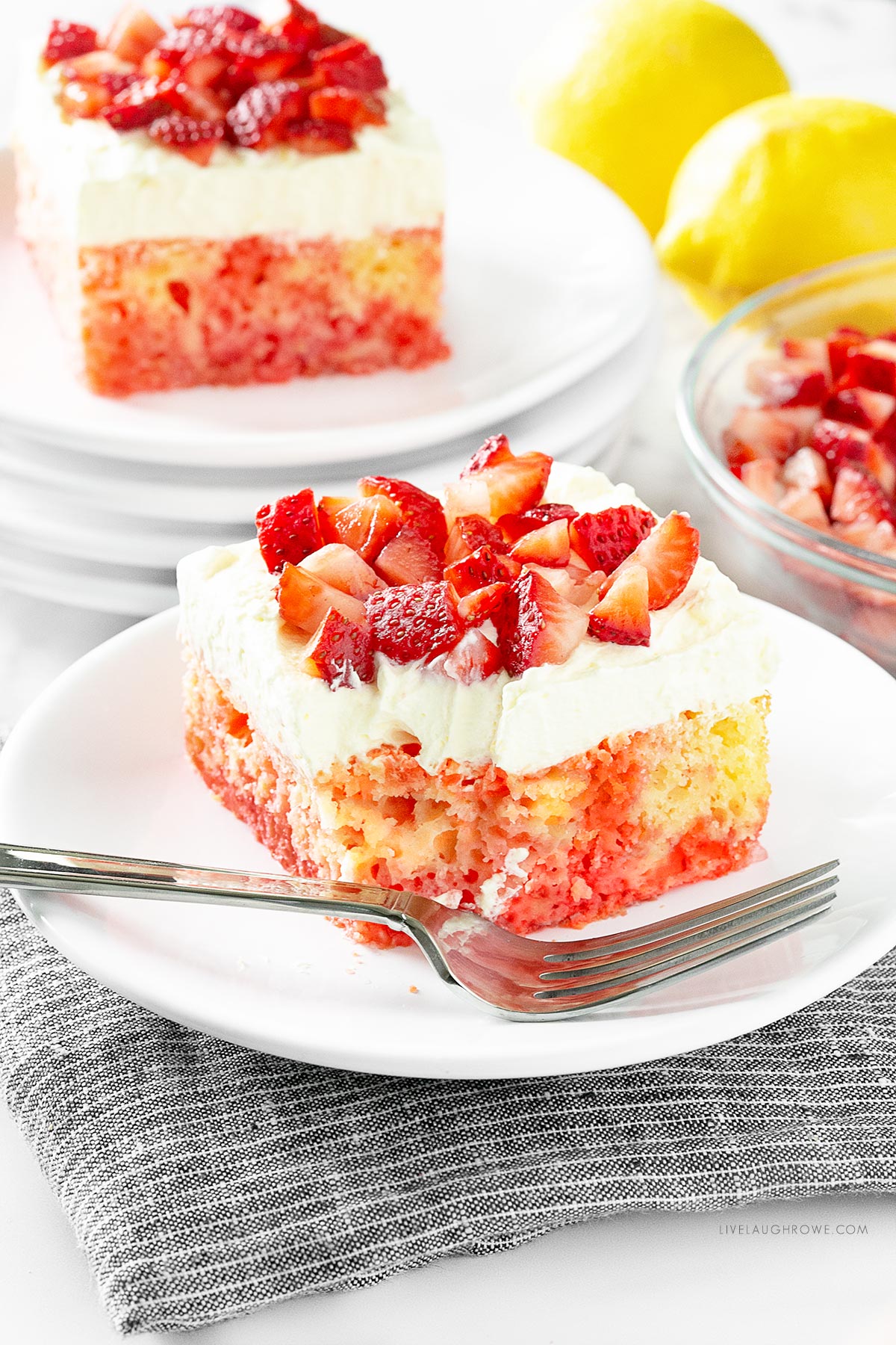 Slice of Strawberry Lemonade Poke Cake