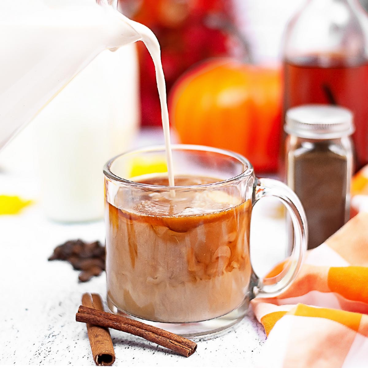 Pouring Sugar-Free Pumpkin Spice Creamer into Coffee