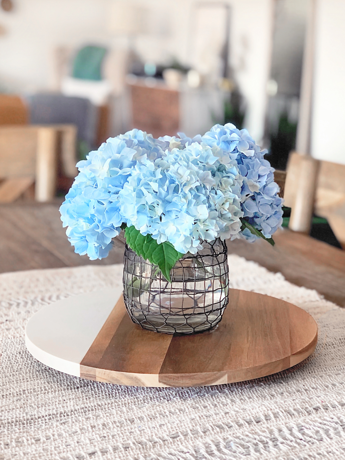 Beautiful hydrangeas in a vase on a table.