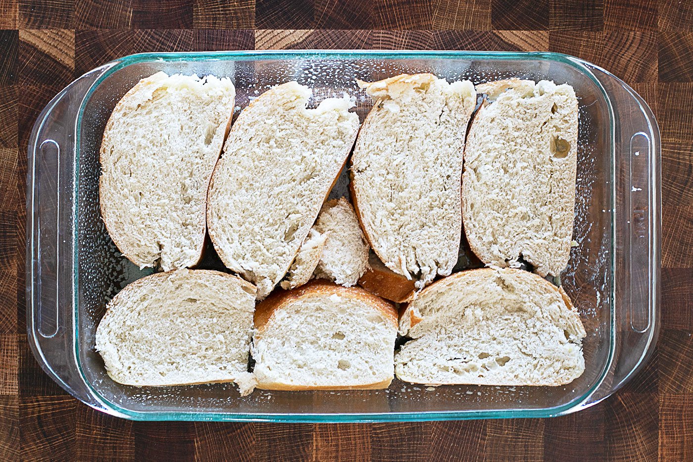 french bread slices in casserole dish