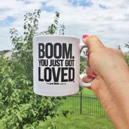 Boom! You just got loved coffee mug being held in the air.