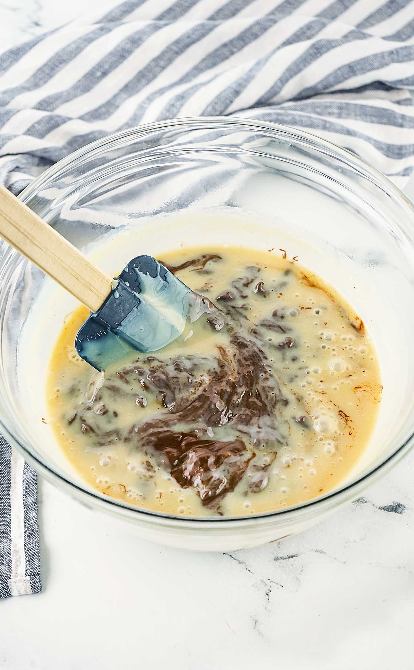 Stirring Condensed Milk and Chocolate Chips together