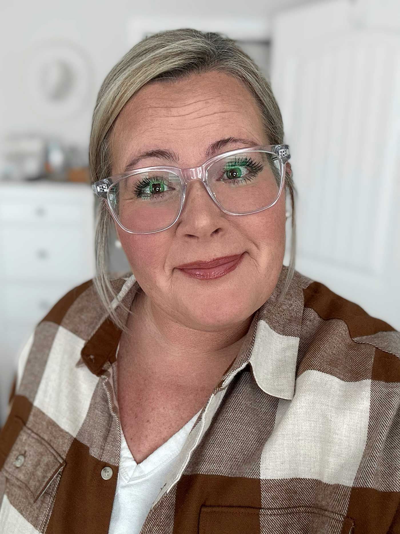 girl in glasses wearing a flannel shirt