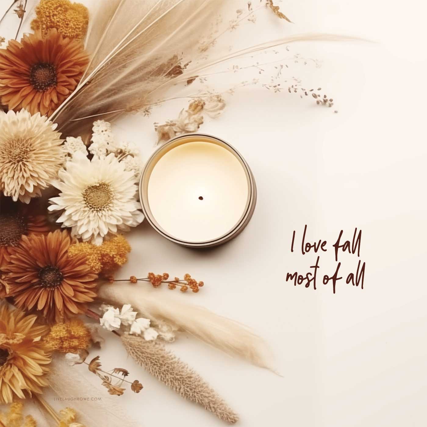 fall colored flowers with a candle with text i love fall most of all