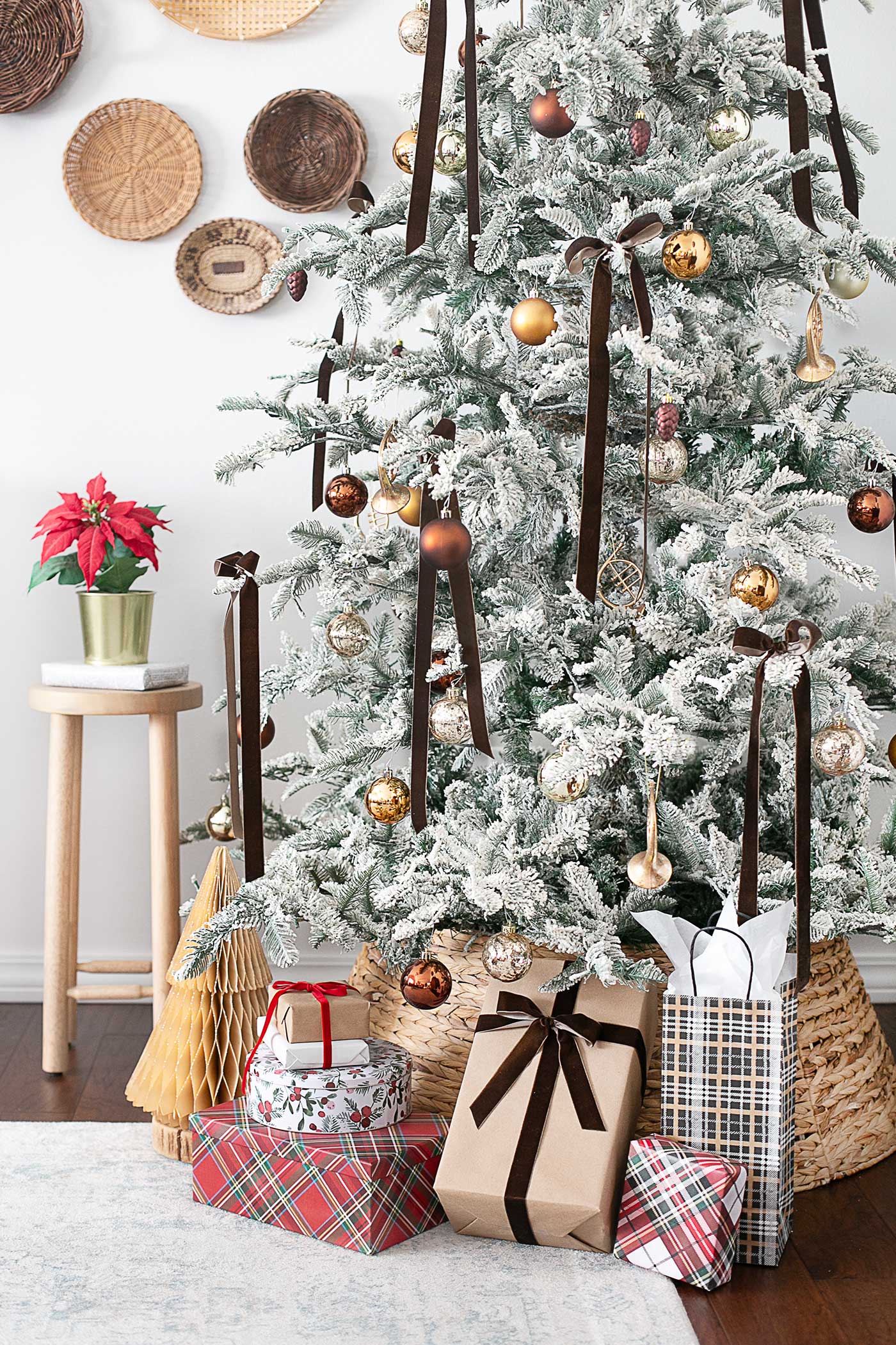 Flocked Tree in a Cozy Living Room with gifts under tree