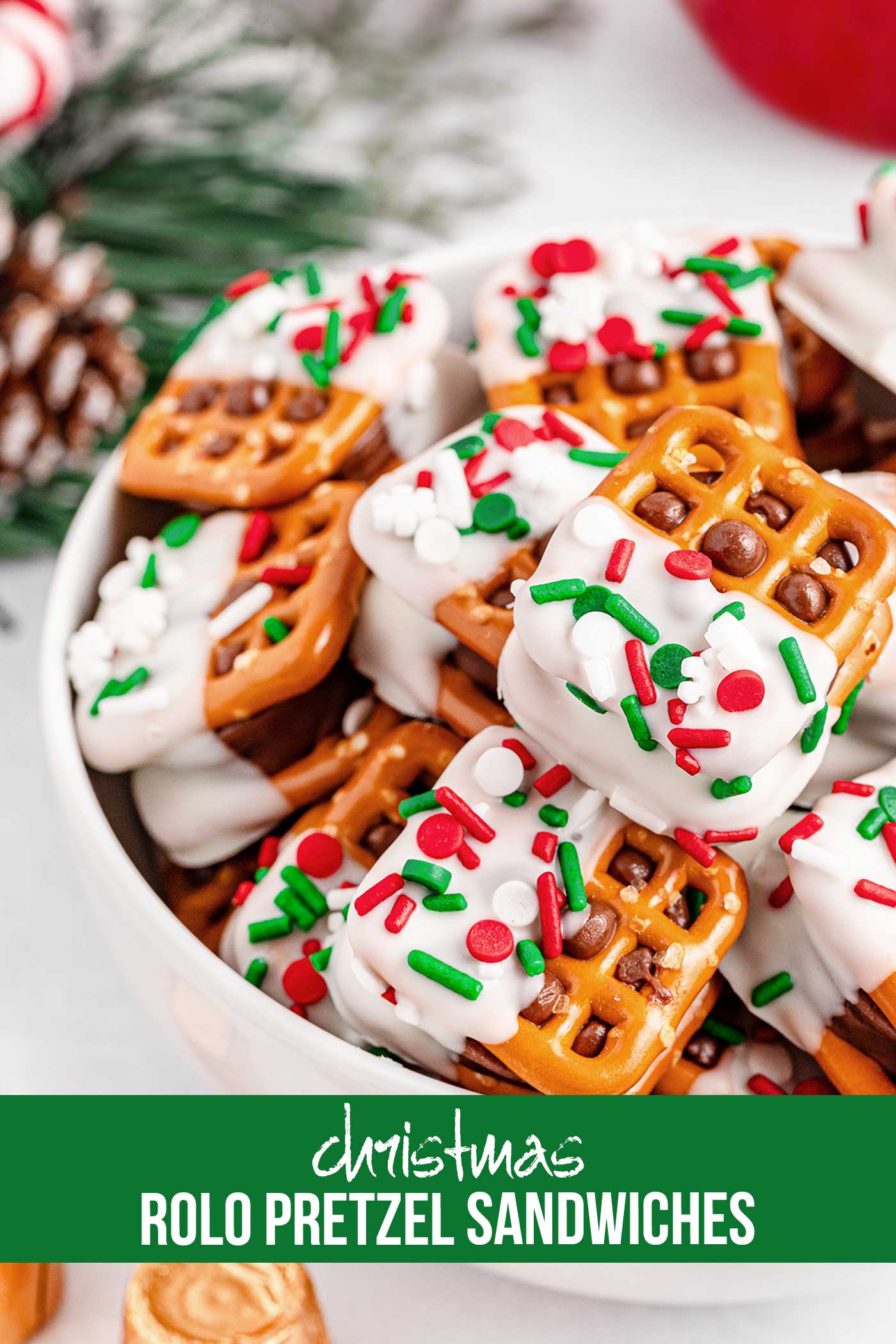 festive rolo pretzel sandwiches in a white bowl with text on the picture