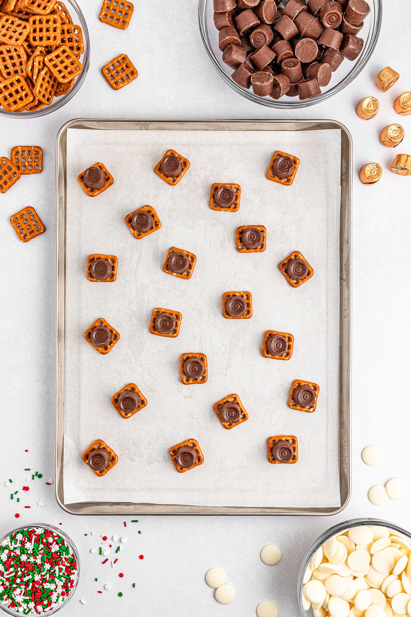 rolos on pretzels on a cookie sheet