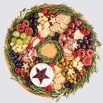 Beautiful Wreath Charcuterie packed with cheese, fruits, crackers, olives and more