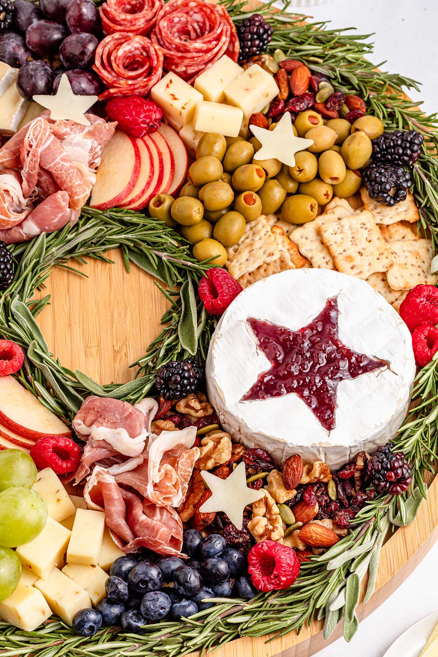 close up of christmas charcuterie wreath, cranberry star in brie