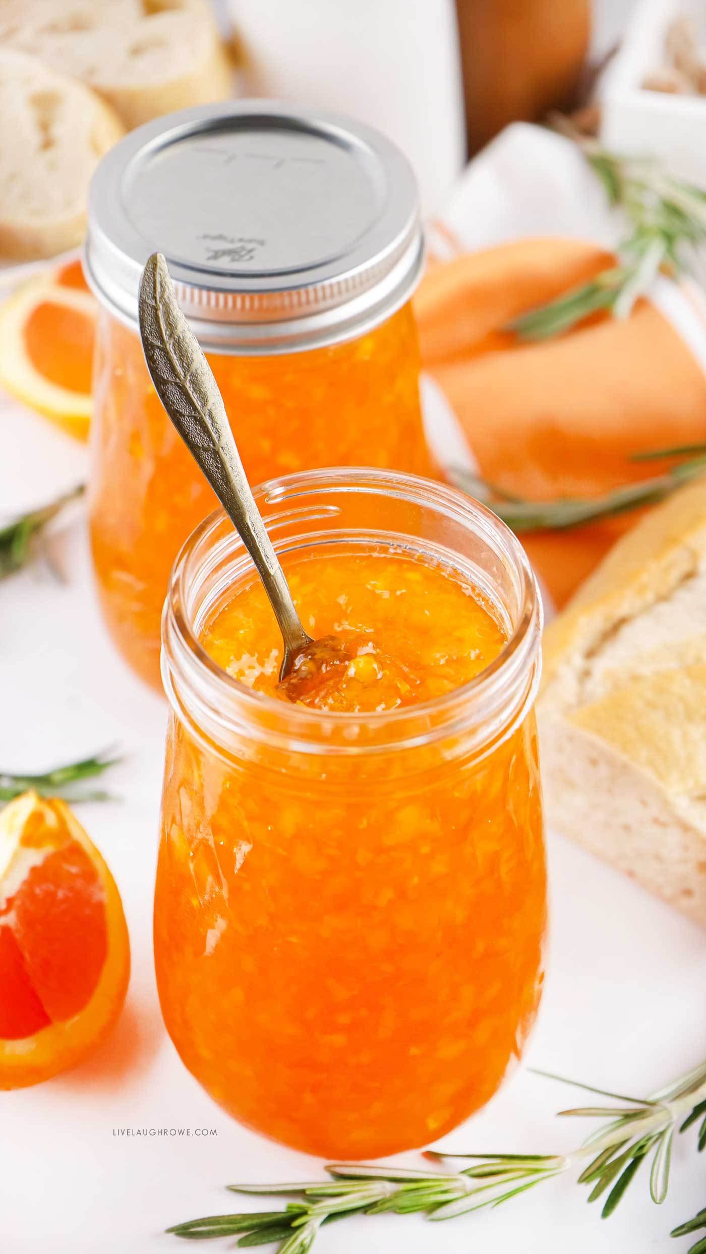 jar of orange marmalade with a spoon in it