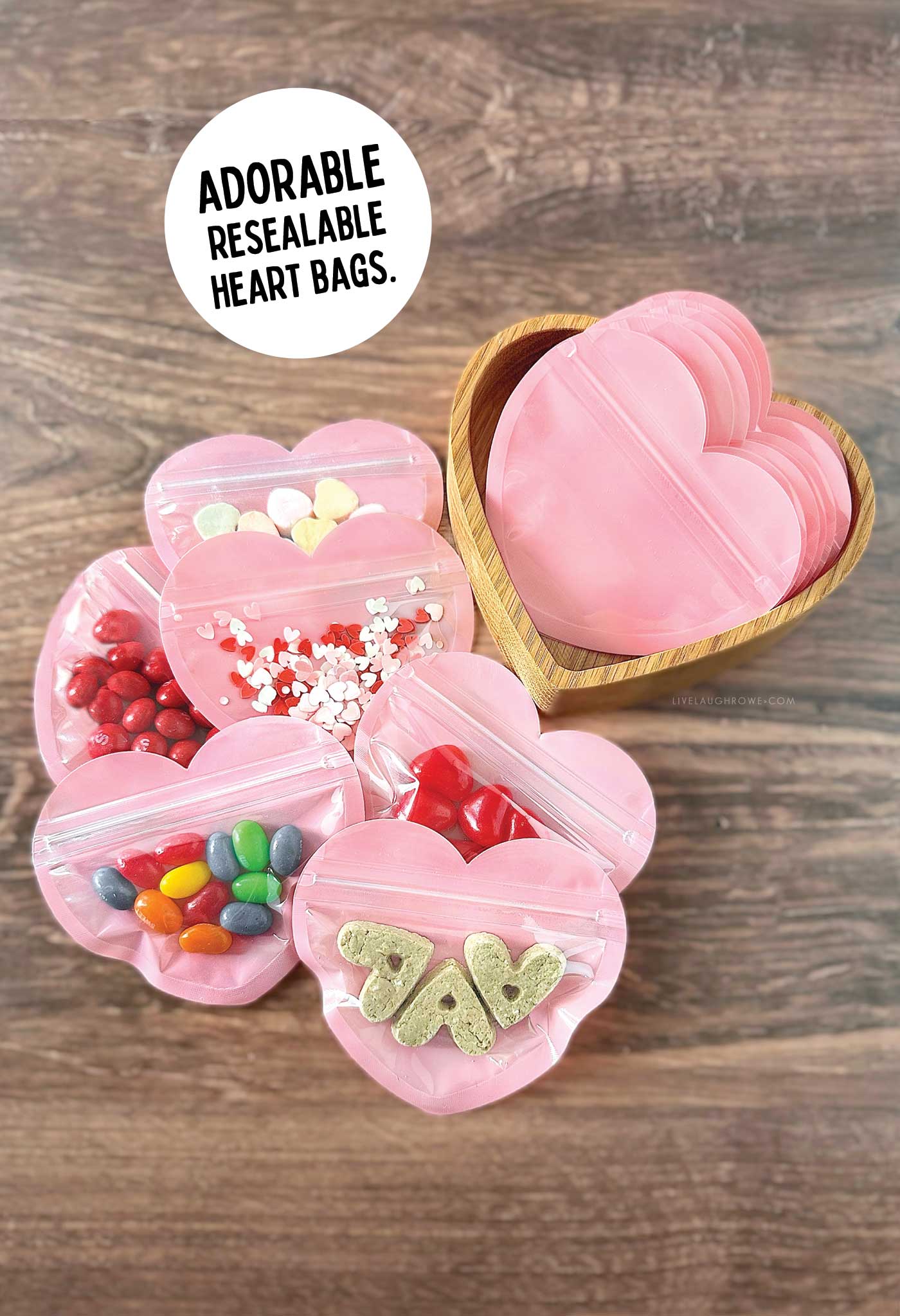 pink resealable bags with a variety of goodies in them