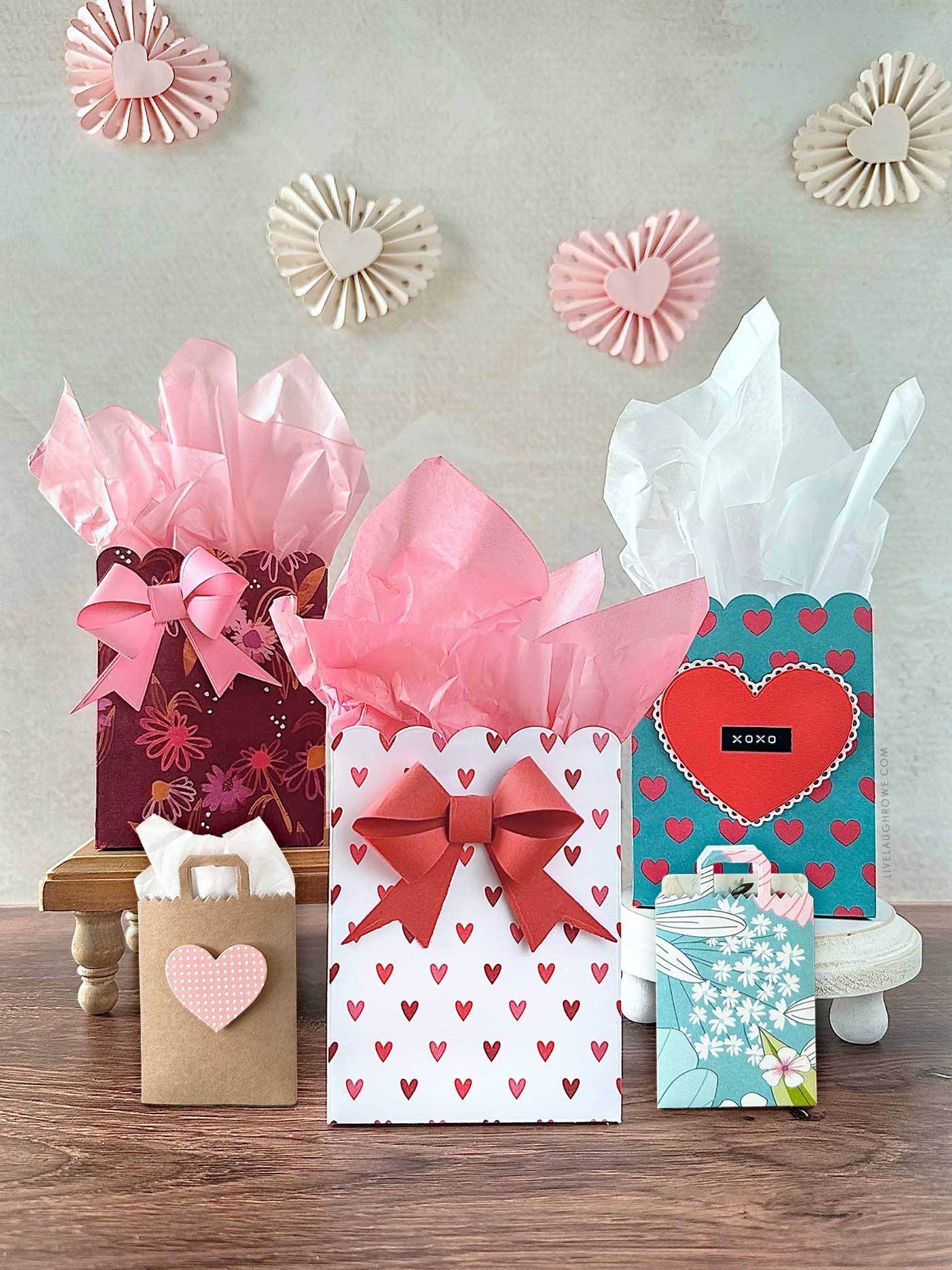 valentine's day inspiration using different paper crafts styled that include scalloped gift bags, gift card holders and rosette garland