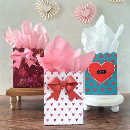 valentine's day inspiration using different paper crafts styled that include scalloped gift bags, gift card holders and rosette garland