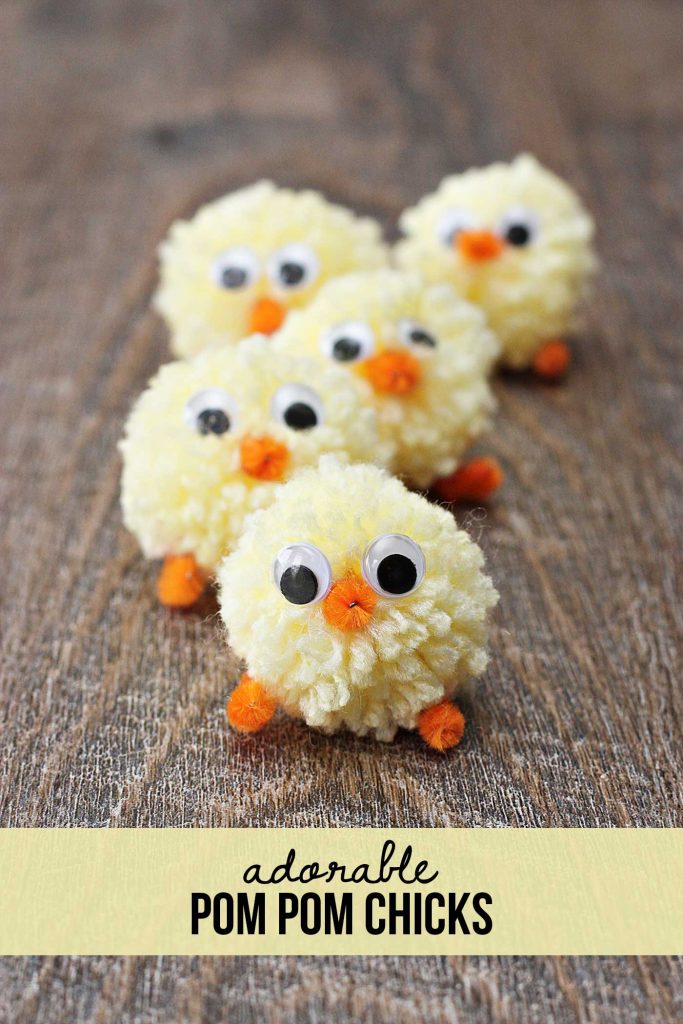 little yarn chicks made of pom poms, pipe cleaners and wiggly eyes