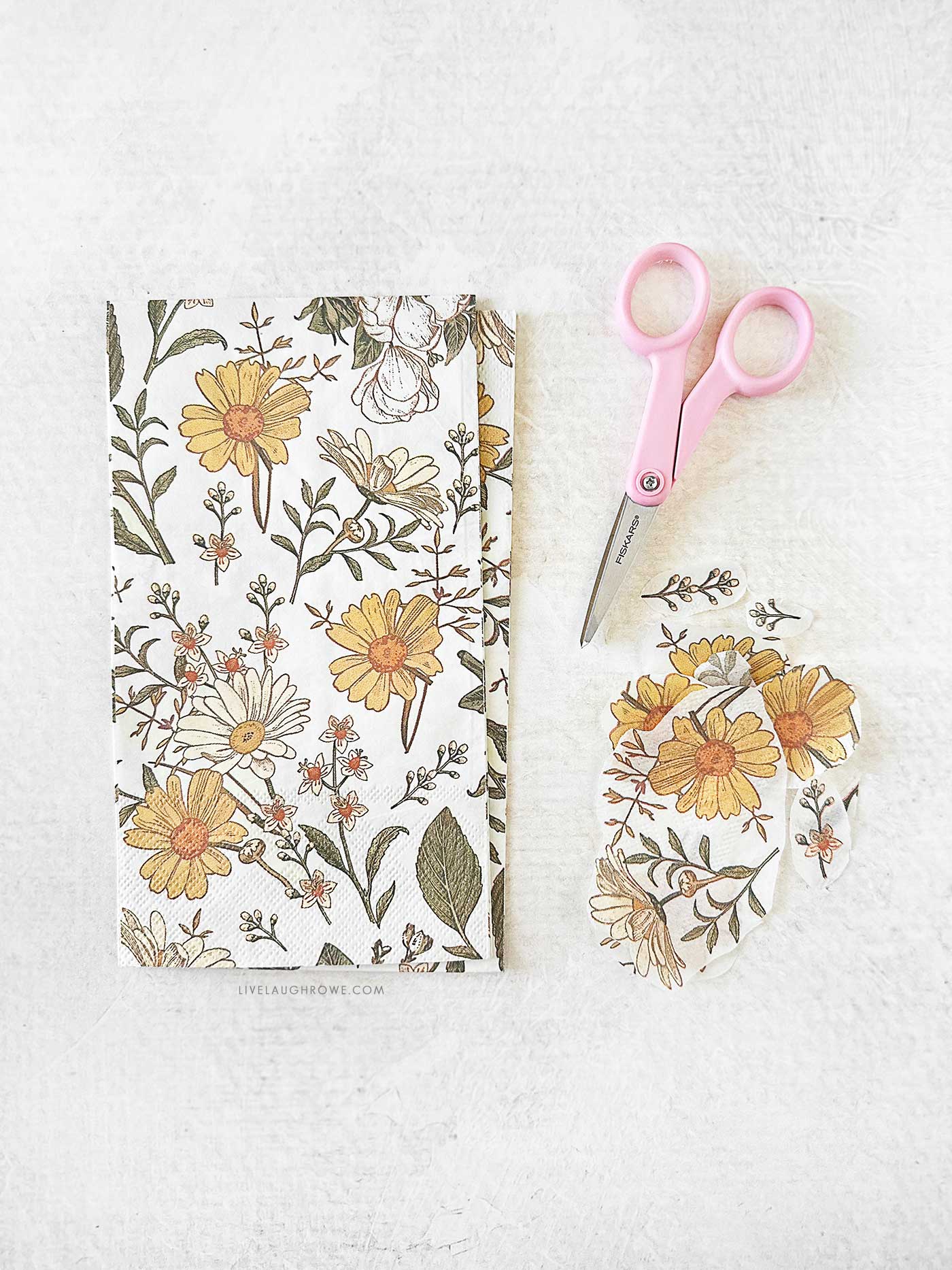 floral napkins with daisies, scissors and cutouts from the napkins