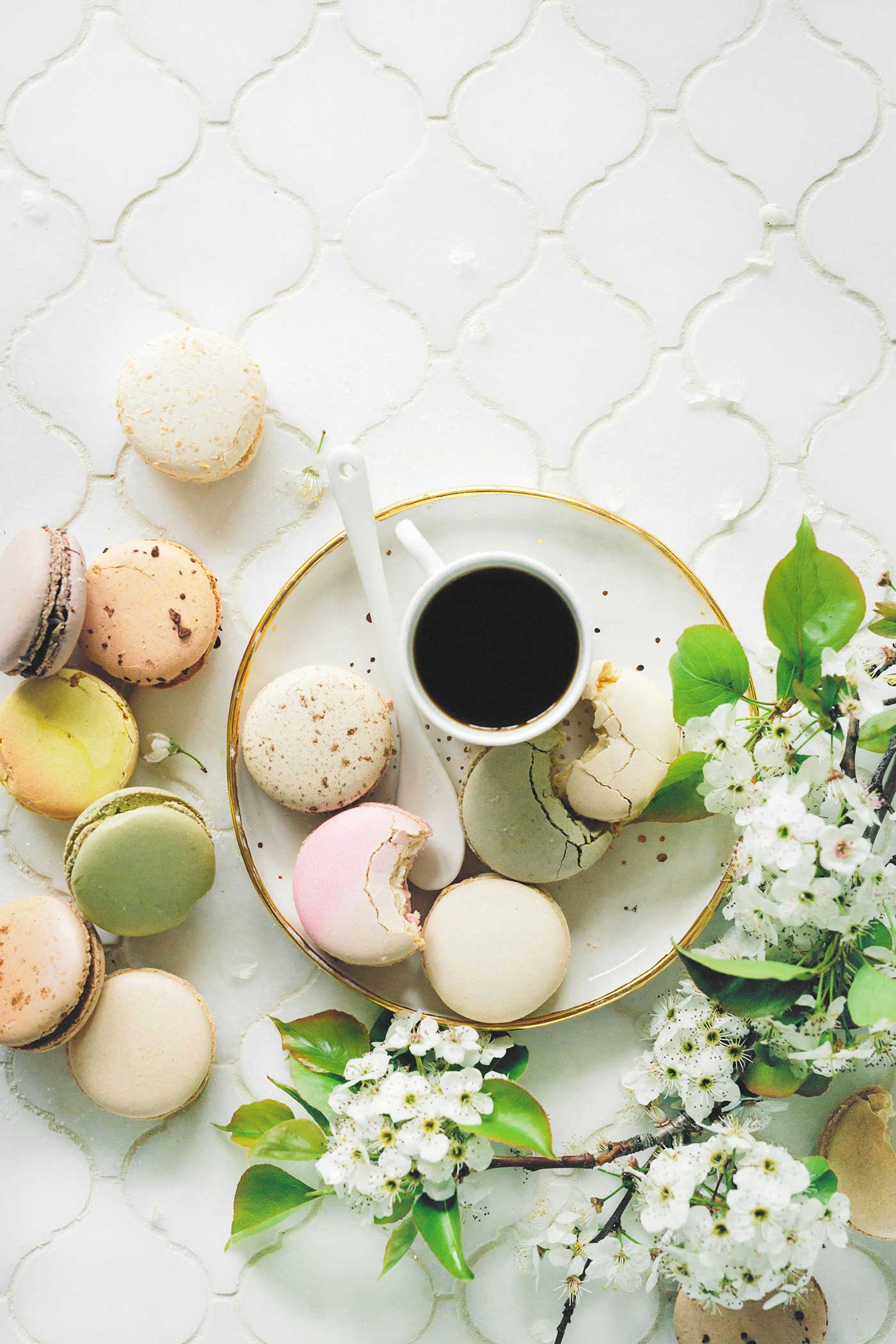 plate with coffee and macaroons with flowers