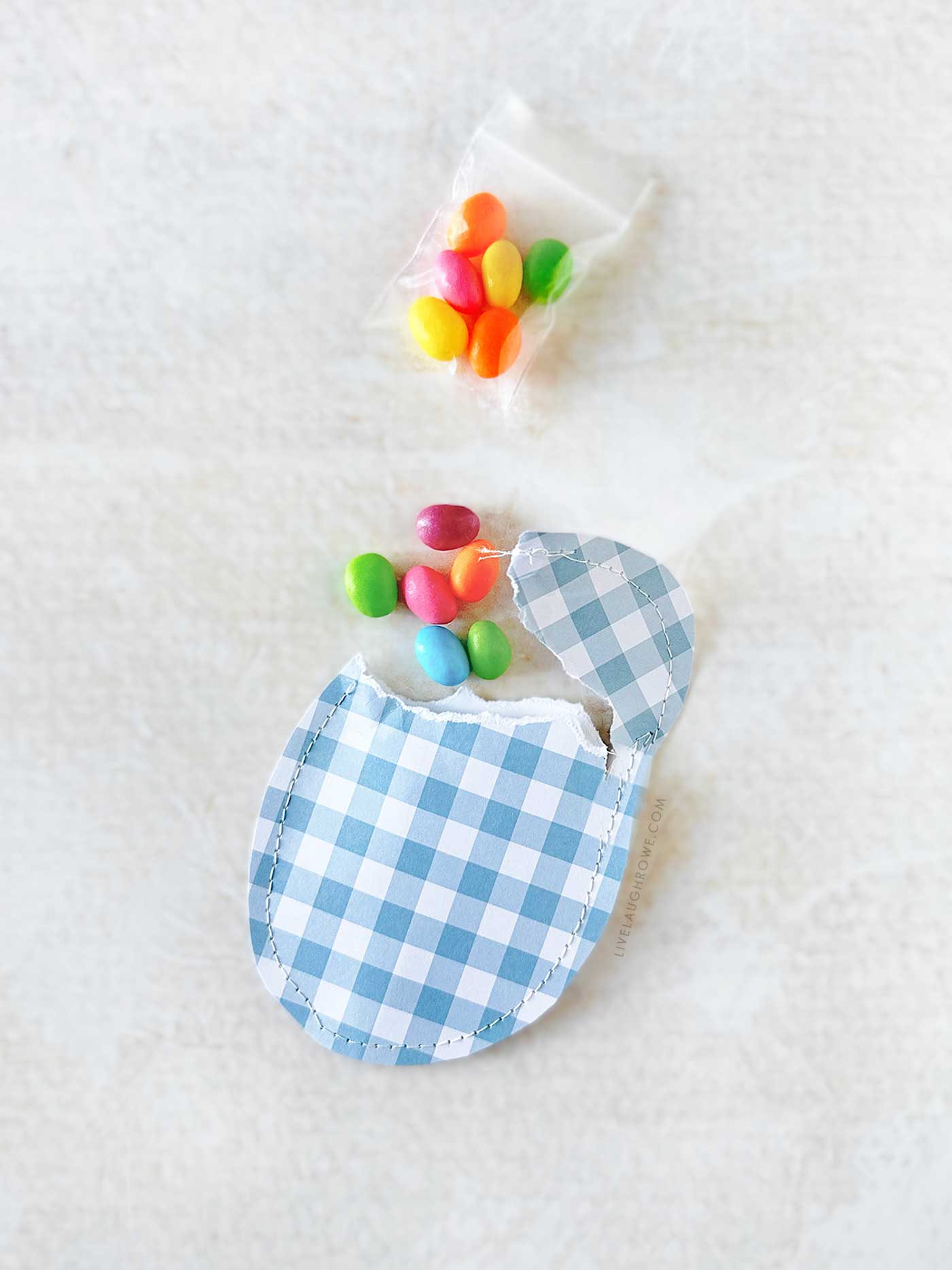 paper egg that is ripped open with candy inside 