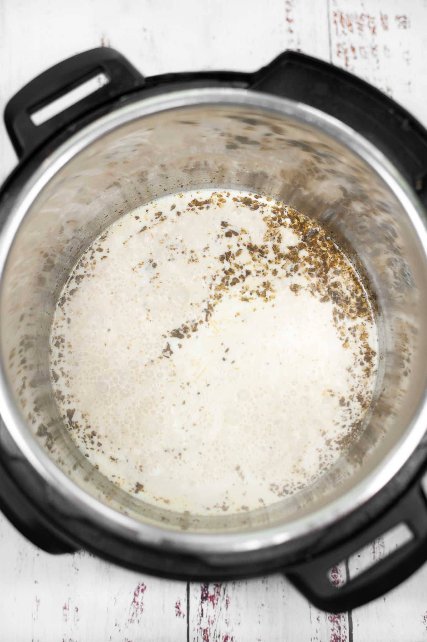 chicken stock, heavy cream and herbs setting in the instant pot
