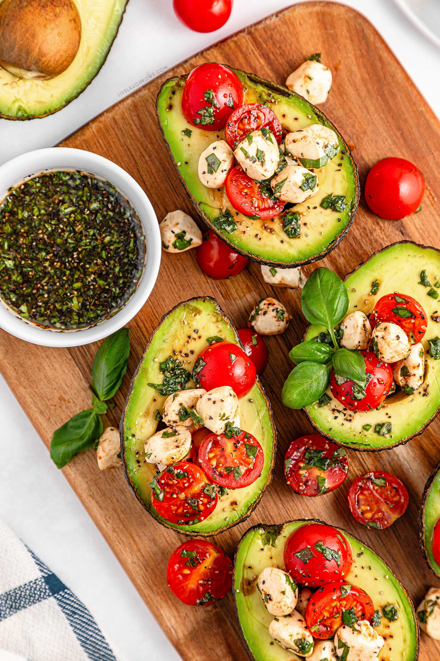 wooden platter with a healthy summer avocado dish