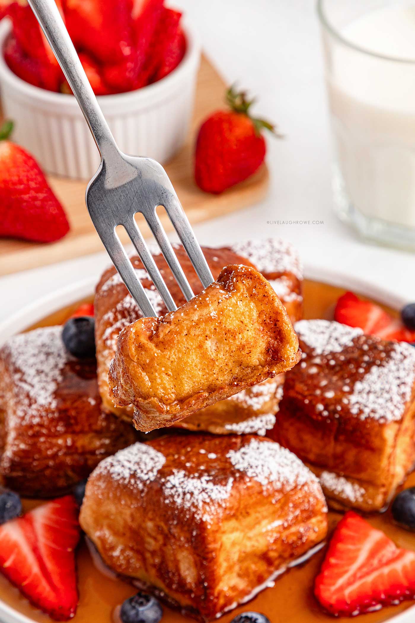 Close-up of fluffy Hawaiian Roll French Toast with powdered sugar