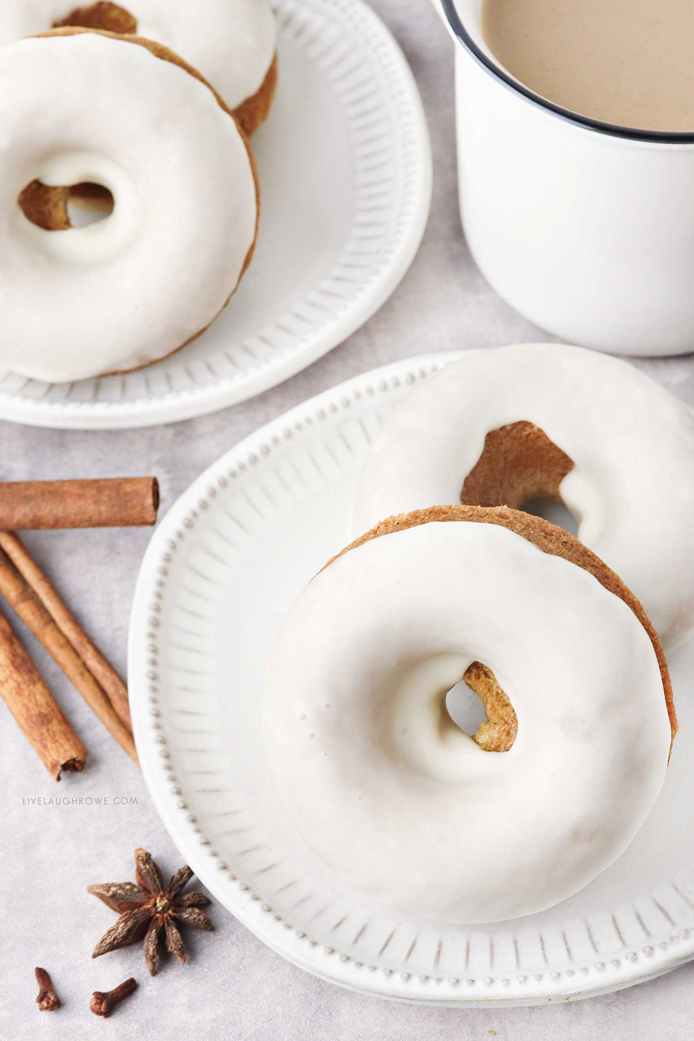 Baked Orange Spice Donuts stacked on a plate, perfect for autumn mornings.