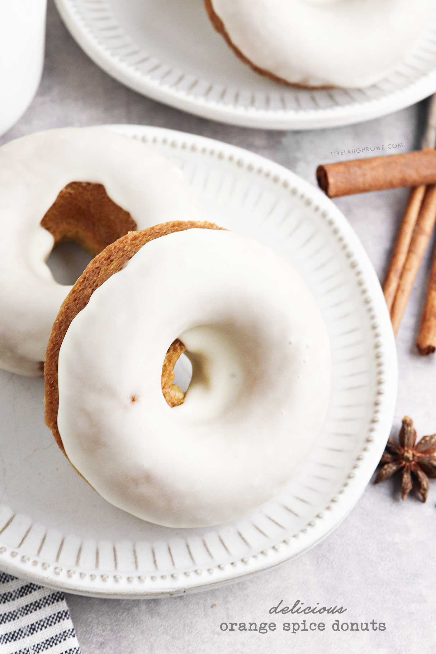 Holiday-inspired donuts with orange glaze and cozy spice flavors