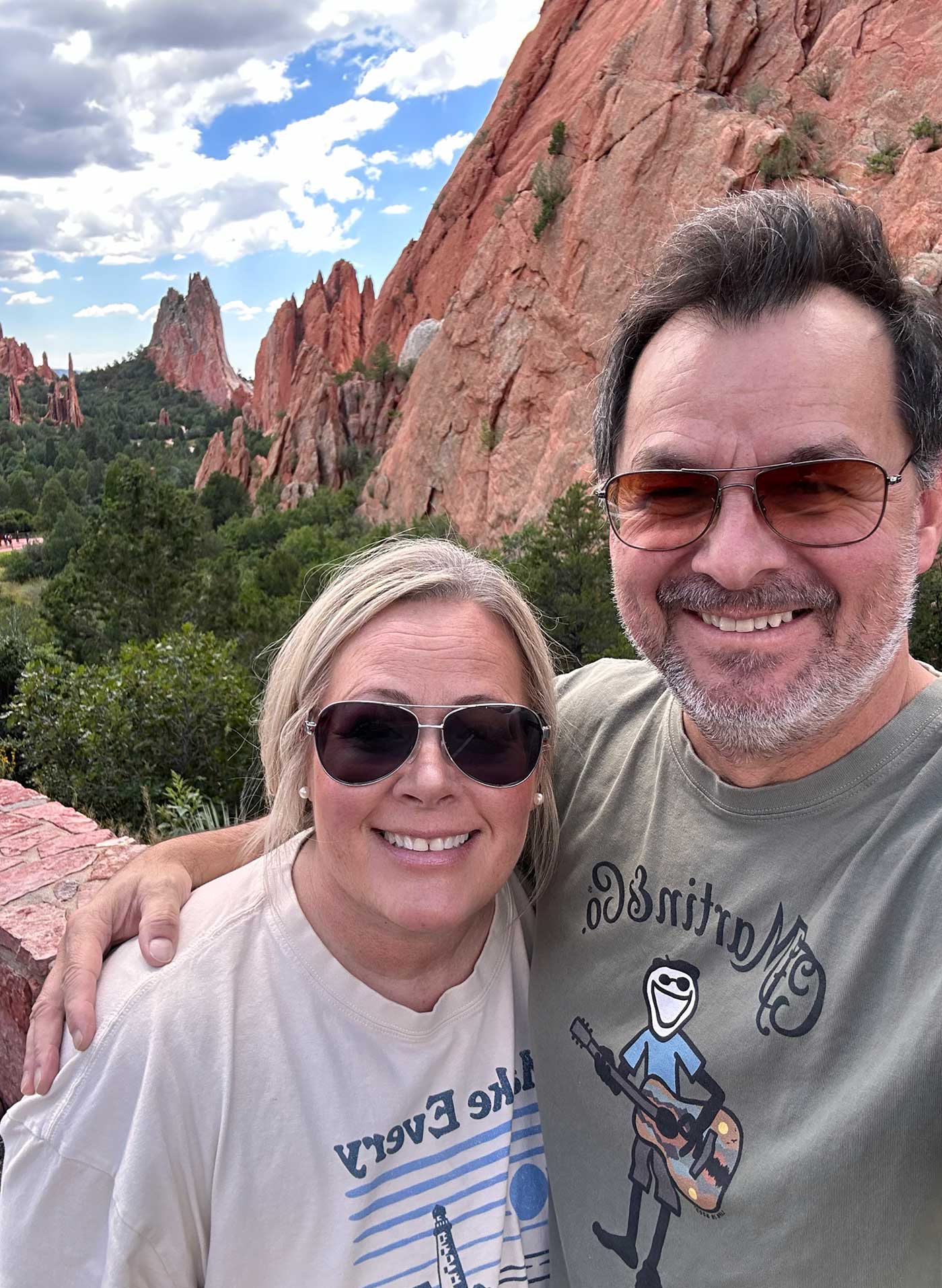 Couple smiling at a scenic overlook in Colorado Springs