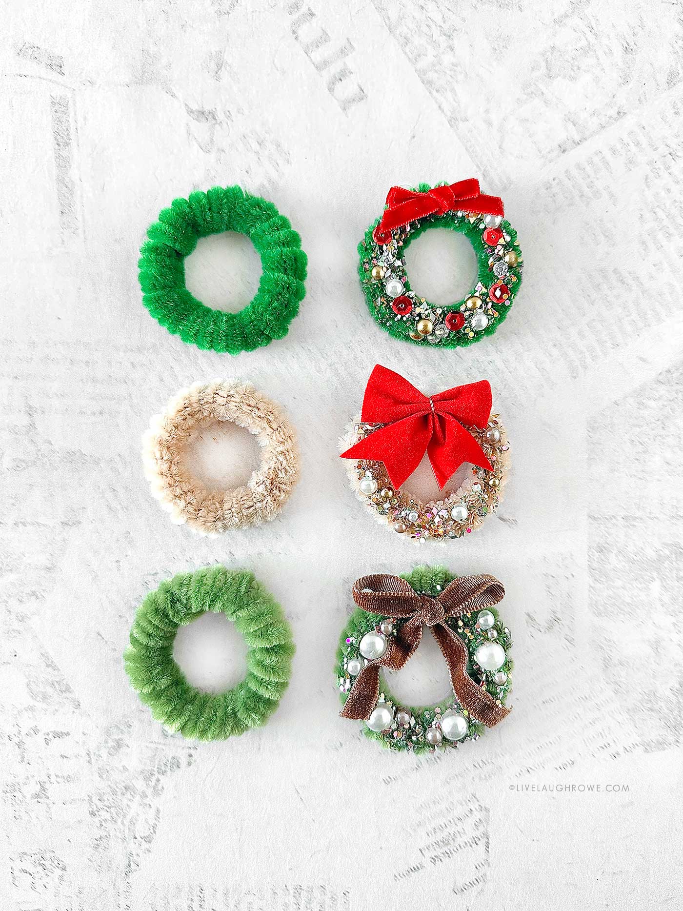 Group of finished pipe cleaner wreaths in assorted colors and sizes.