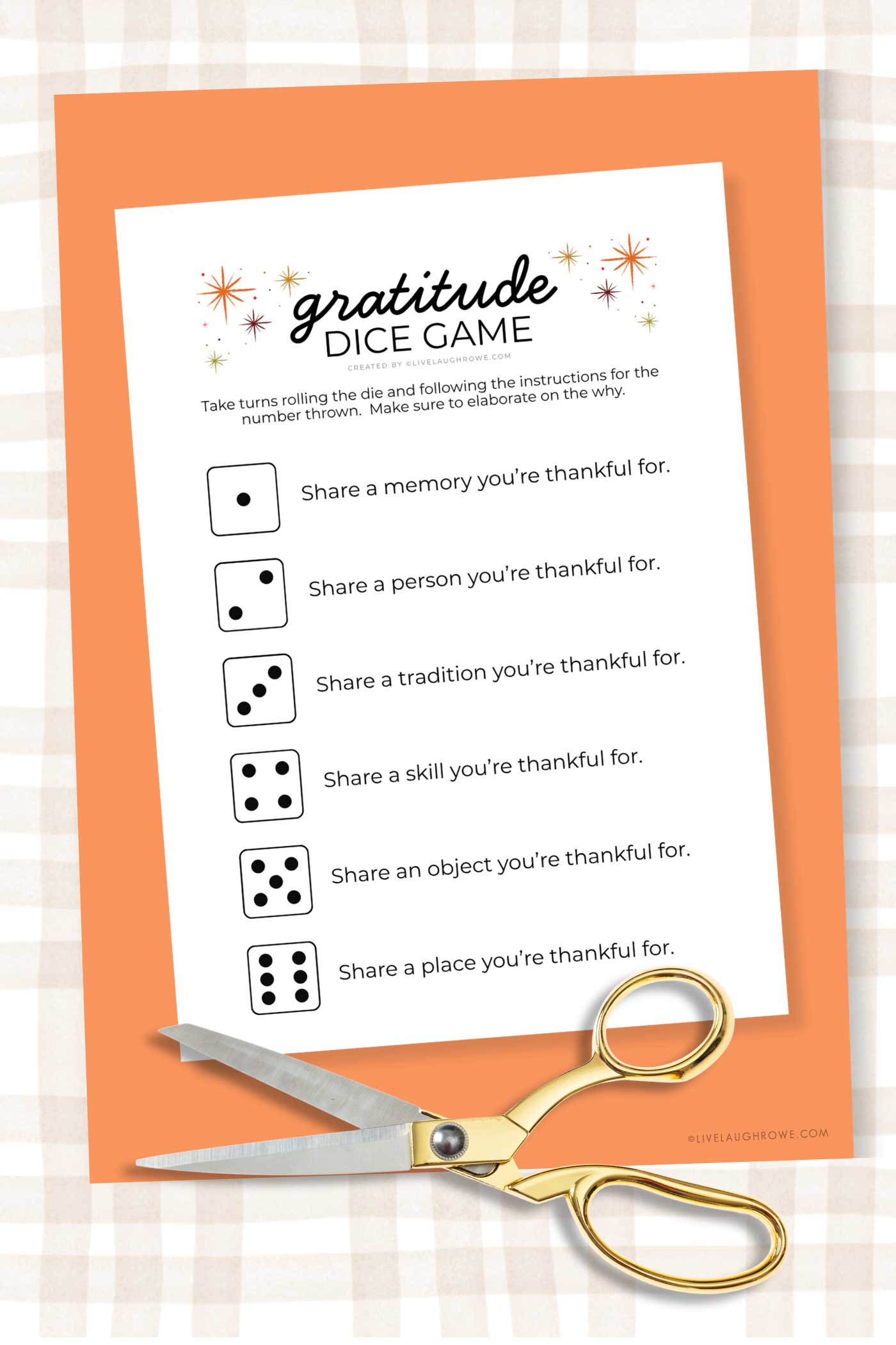 Gratitude Dice Game printable displayed on an orange background with gold-handled scissors, ready to be cut and used.