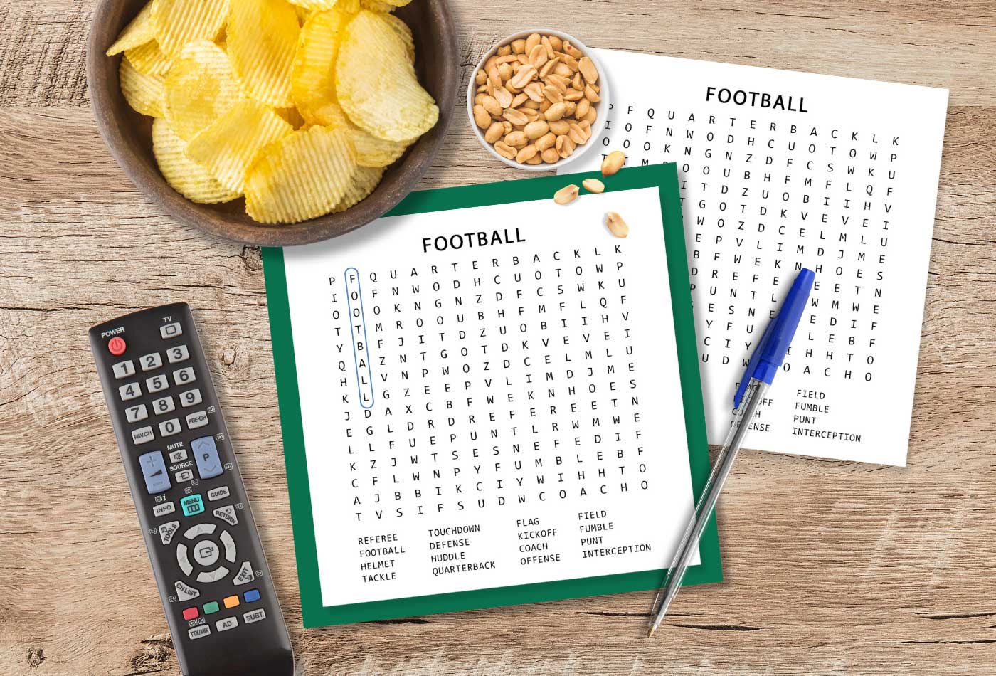 Football Word Search printable on a table with pen and snacks for Super Bowl Sunday